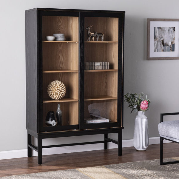 Safavieh Hearzly Ash Veneer Glass Door Display Cabinet With Iron Legs For Modern Living Spaces HZ1093805
