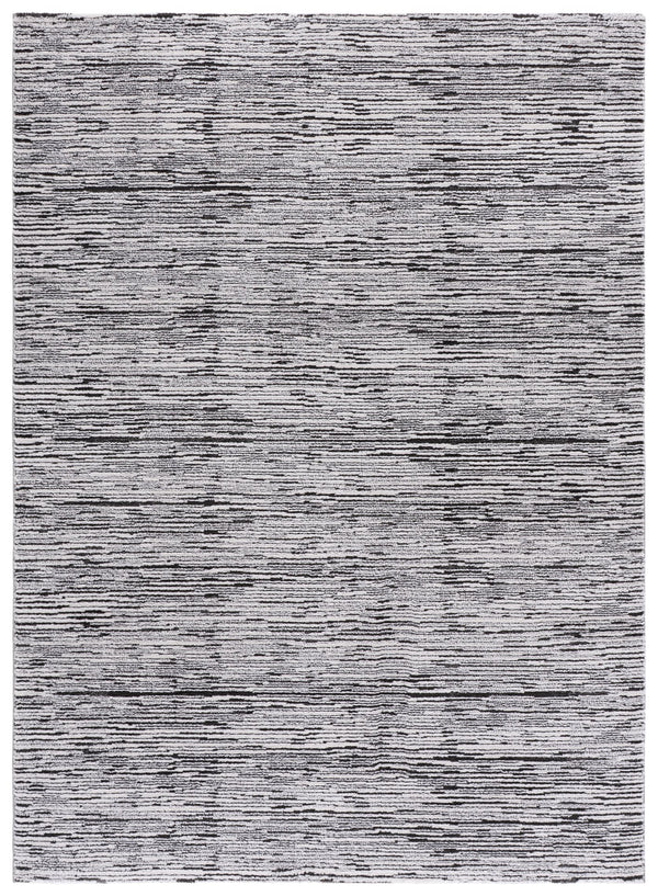 Safavieh Lunara Modern Black & Ivory Low-Pile Rug, Power-Loomed In Turkey For Durable, Elegant Texture 5'-3" x 7'-6" LUA302Z-5