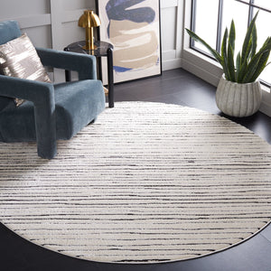 Safavieh Melody Modern Abstract Area Rug - Luxurious Polyester Design For Elegant Home Décor And Style Ivory ,Black Polyester Mel118a-10