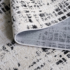 Safavieh Mila Modern Area Rug – Elegant Polyester Design For Contemporary & Classic Interiors, 5/8" Height Black ,Ivory Polyester Mil230z-7sq