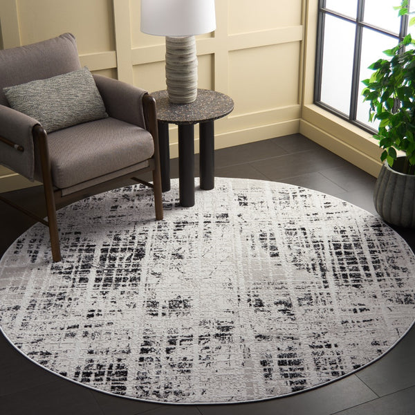 Safavieh Mila Modern Area Rug – Elegant Polyester Design For Contemporary & Classic Interiors, 5/8" Height Black ,Ivory Polyester Mil230z-7sq