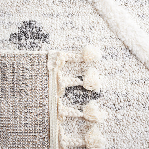 Safavieh Moroccan Tassel Shag Area Rug - Luxuriously Soft And Durable Design For Cozy Living Spaces Beige ,Ivory Polypropylene Pile Mts644a-8