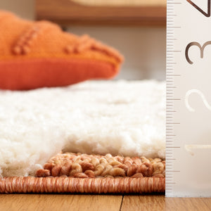 Safavieh Moroccan Tassel Shag 688 Power Loomed Shag & Flokati Rug Ivory / Brick Rust 5'-3" x 7'-6"