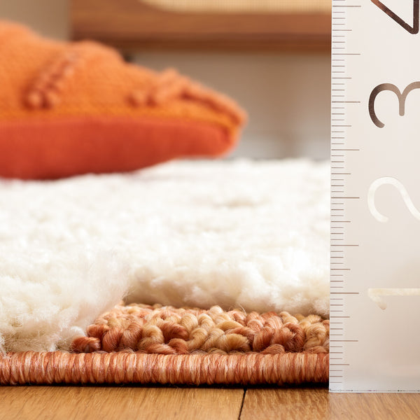 Safavieh Moroccan Tassel Shag 688 Power Loomed Shag & Flokati Rug Ivory / Brick Rust 5'-3" x 7'-6"