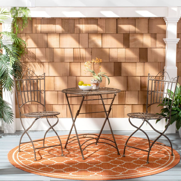 Safavieh BELEN Bistro Set - Elegant Outdoor Table and Two Chairs with Victorian Ironwork Design for Patios Unearthed Rust / - PAT5020B