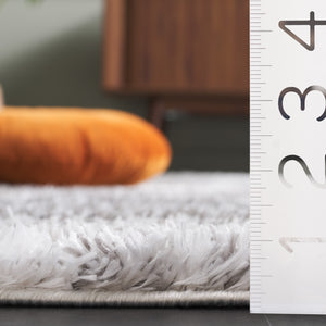 Safavieh Penelope Luxurious Shag Area Rug - Soft, Durable, And Elegant Design For Cozy Living Spaces Grey ,Ivory 73% Polyester,27% Jute Pnl520f-4