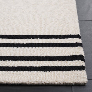 Safavieh Rodeo Drive 5' X 8' Ivory/Black Area Rug - Luxurious Hand-tufted Wool & Cotton For Cozy Elegance Ivory ,Black 80% Wool & 20% Cotton Rd680z-5