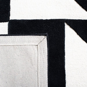 Safavieh Rodeo Drive 857 Hand Tufted Contemporary Rug IIX Ivory / Black RD857A-5