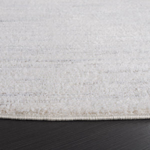 Safavieh Revive 114 Power Loomed Solid & Tonal Rug Ivory 6'-7" x 6'-7" Round