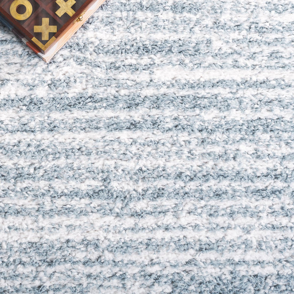 Safavieh Rumi Luxurious Round Shag Area Rug - Elegant Ivory Beige Design For Cozy Home Spaces 6ft 7in Light Blue ,Ivory Polyester Rms110l-6