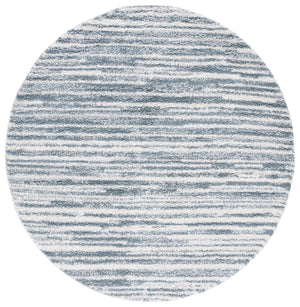 Safavieh Rumi Luxurious Round Shag Area Rug - Elegant Ivory Beige Design For Cozy Home Spaces 6ft 7in Light Blue ,Ivory Polyester Rms110l-6