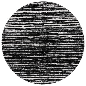 Safavieh Rumi Luxurious Round Shag Area Rug - Elegant Ivory Beige Design For Cozy Home Spaces 6ft 7in Black ,Ivory Polyester Rms110z-28