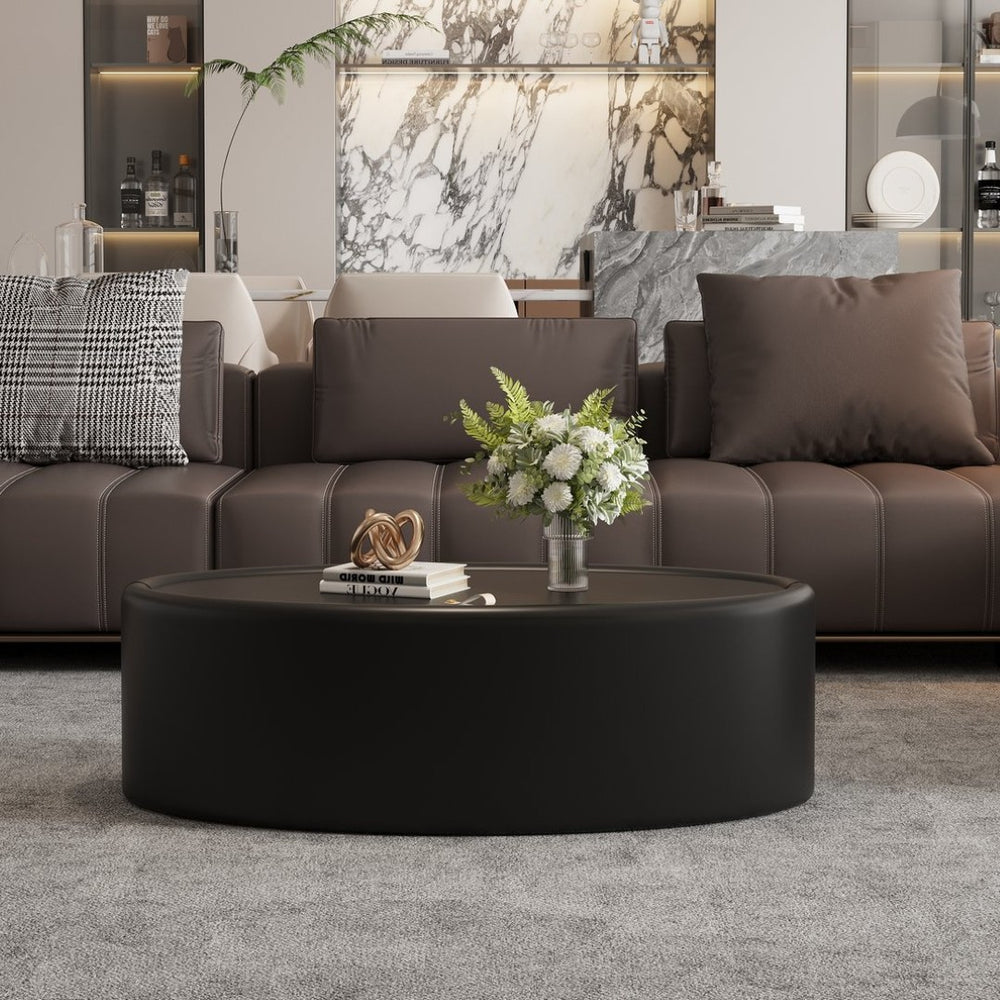 English Elm 33.46 Oval Faux Leather Coffee Table with Flip Open Hidden Storage and Tempered Glass Top W3158P496084