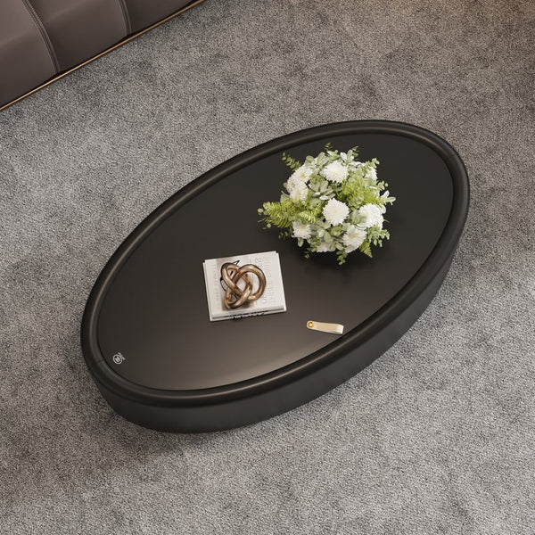 English Elm 33.46 Oval Faux Leather Coffee Table with Flip Open Hidden Storage and Tempered Glass Top W3158P496084