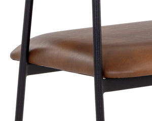 Sunpan Brenan Dining Armchair – Elegant Curved Backrest, Faux Leather Comfort, Black Metal Frame, Unique Craftsmanship Bravo Cognac
