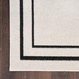 Nourison Essentials NRE02 Machine Made Power-loomed Narrow Border Indoor/Outdoor Contemporary Outdoor Rug Ivory,Black, Ivory Black 100% Polypropylene 99446148384