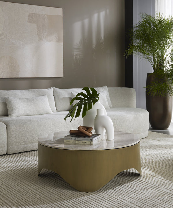 Sunpan Guinevere Coffee Table - Handcrafted Crema Marble Top with Curvy Antique Brass Iron Base, Unique Design