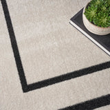 Nourison Essentials NRE02 Machine Made Power-loomed Narrow Border Indoor/Outdoor Contemporary Outdoor Rug Ivory,Black, Ivory Black 100% Polypropylene 99446148407