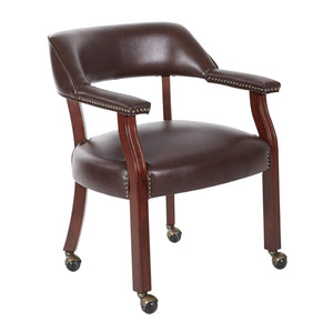 OSP Home Furnishings Traditional Guest Chair with Brass Nailhead Trim Vinyl Upholstery and Rolling Casters TV231-JT4