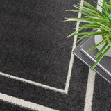 Nourison Essentials NRE02 Machine Made Power-loomed Narrow Border Indoor/Outdoor Contemporary Outdoor Rug Black Ivory, Black Ivory 100% Polypropylene 99446137425