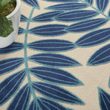 8’ Round Navy and Beige Leaves Indoor Outdoor Area Rug