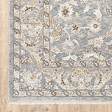 7' x 10' Blue Ivory Machine Woven Floral Oriental Indoor Area Rug