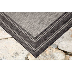 Trans-Ocean Liora Manne Carmel Multi Border Casual Indoor/Outdoor Power Loomed 87% Polypropylene/13% Polyester Rug Black 7'10" x 9'10"
