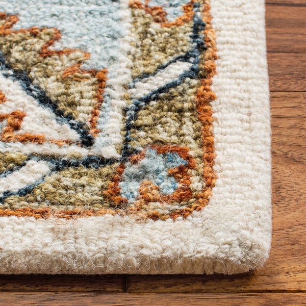 Capri 209  Hand Tufted 100% Wool Pile Rug Ivory / Rust