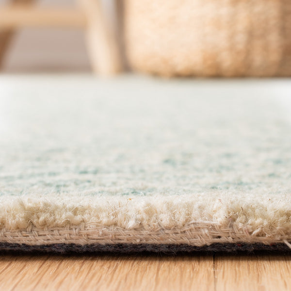 Capri 215  Hand Tufted 100% Wool Pile Rug Blue / Ivory