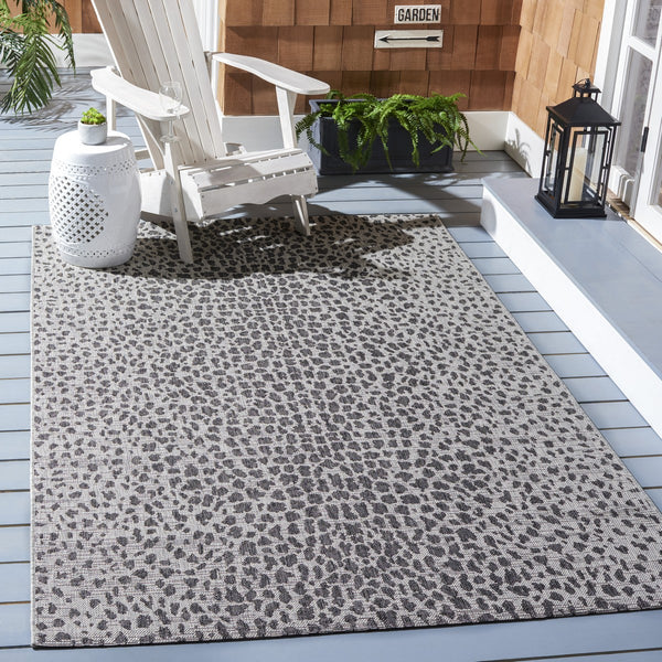 Courtyard 8000 Indoor/Outdoor Power Loomed 85.4% Polypropylene, 10.4% Polyester, 4.2% Latex Rug Grey / Black