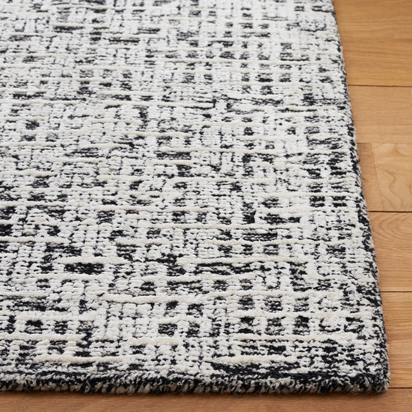 Safavieh Glamour 601 Modern Hand Tufted Rug Black / Ivory GLM601Z-8