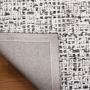 Safavieh Glamour 601 Modern Hand Tufted Rug Black / Ivory GLM601Z-8