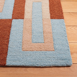 Safavieh Genre 102 Hand Tufted Modern Rug Light Blue / Rust 8' x 10'