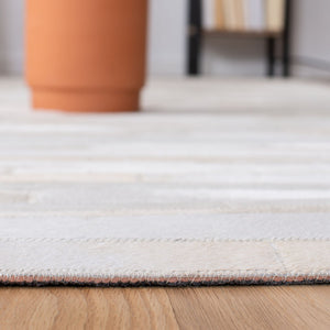 Safavieh Studio Leather 800 Hand Woven 70% Leather and 30% Felted Cloth Natural Hide Rug STL804A-9