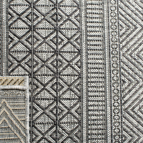 Courtyard  Outdoor Power Loomed 85.4% Polypropylene, 10.4% Polyester, 4.2% Latex Rug Black / Grey
