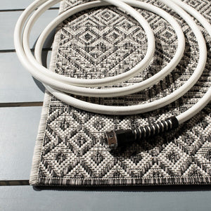 Courtyard  Outdoor Power Loomed 85.4% Polypropylene, 10.4% Polyester, 4.2% Latex Rug Grey / Black