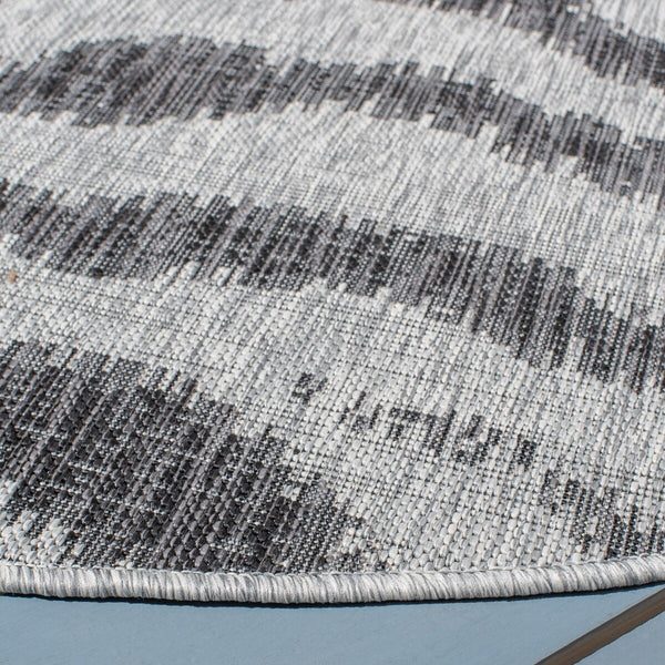 Courtyard 8000 Indoor/Outdoor Power Loomed 85.4% Polypropylene, 10.4% Polyester, 4.2% Latex Rug Grey / Black