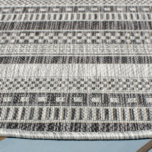 Courtyard  Outdoor Power Loomed 85.4% Polypropylene, 10.4% Polyester, 4.2% Latex Rug Black / Grey