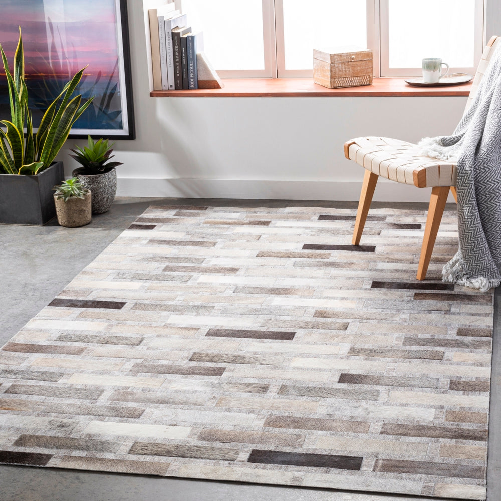 Medora MOD-1023 Rustic Hair On Hide, Viscose, Wool Rug MOD1023-913 Light Gray, Dark Brown, Ivory, Black, Taupe, Medium Gray 60% Hair On Hide, 20% Viscose, 20% Wool 9' x 13'