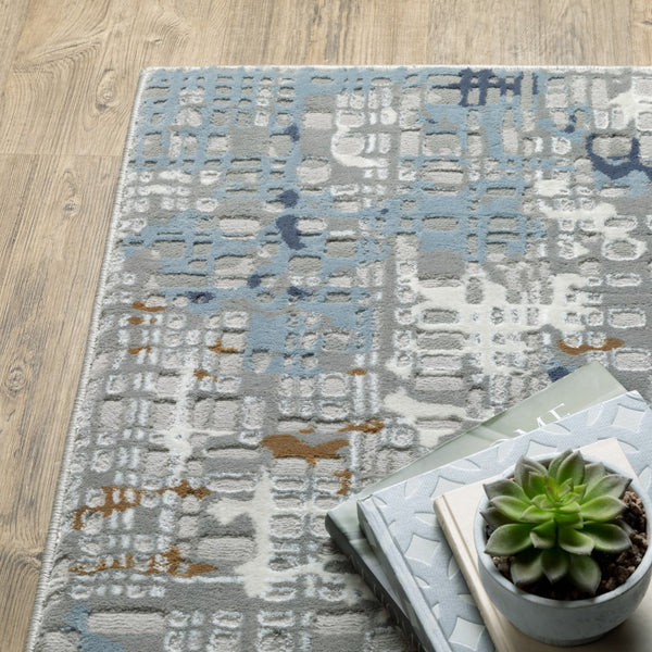 Oriental Weavers Easton 011E3 Contemporary/Industrial Abstract Polypropylene, Polyester Indoor Area Rug Blue/ Ivory 9'10" x 12'10" E011E3300394ST